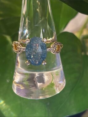 Gold Ring with Oval Blue Gemstone and Pavé Accents
